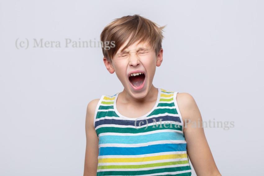 Young boy expressing excitement while shouting in a striped tank