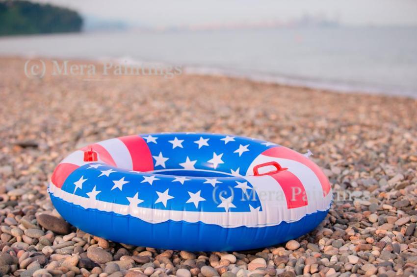 A colorful inflatable float in the colors of the American flag r